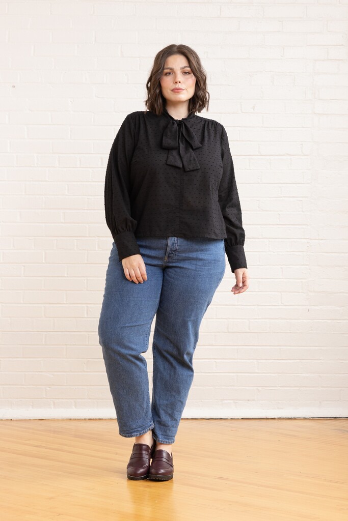 Woman wearing black Garnet blouse