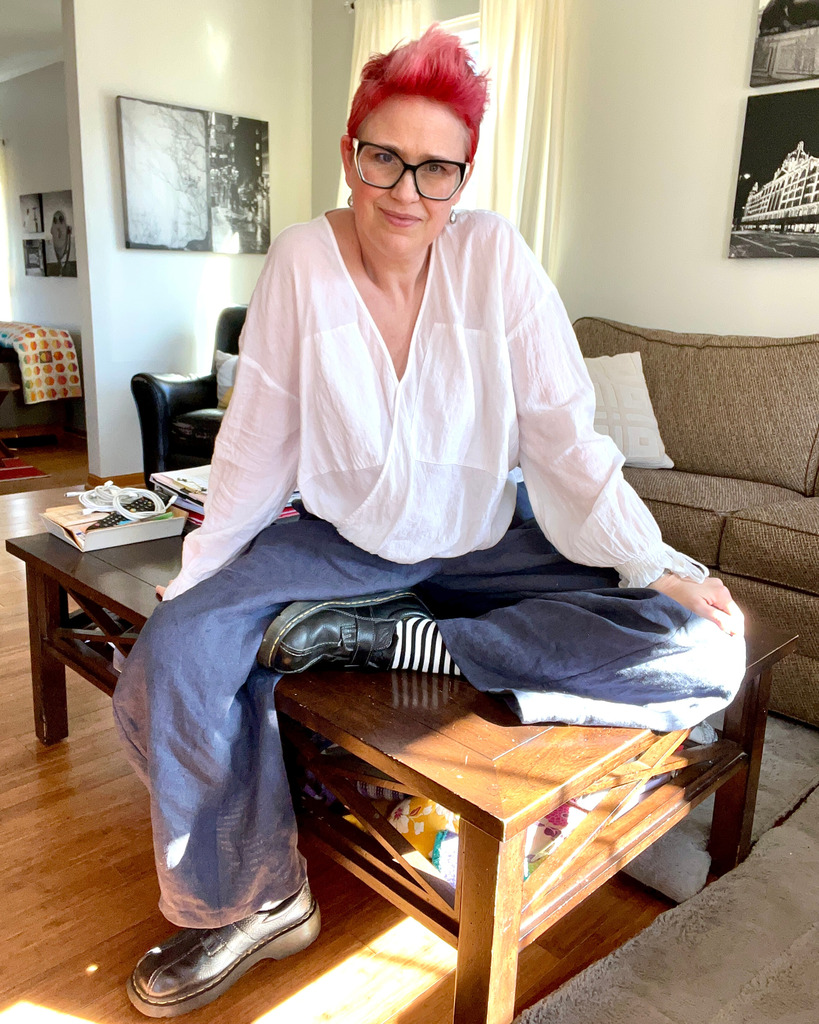 Rebecca sitting on a table