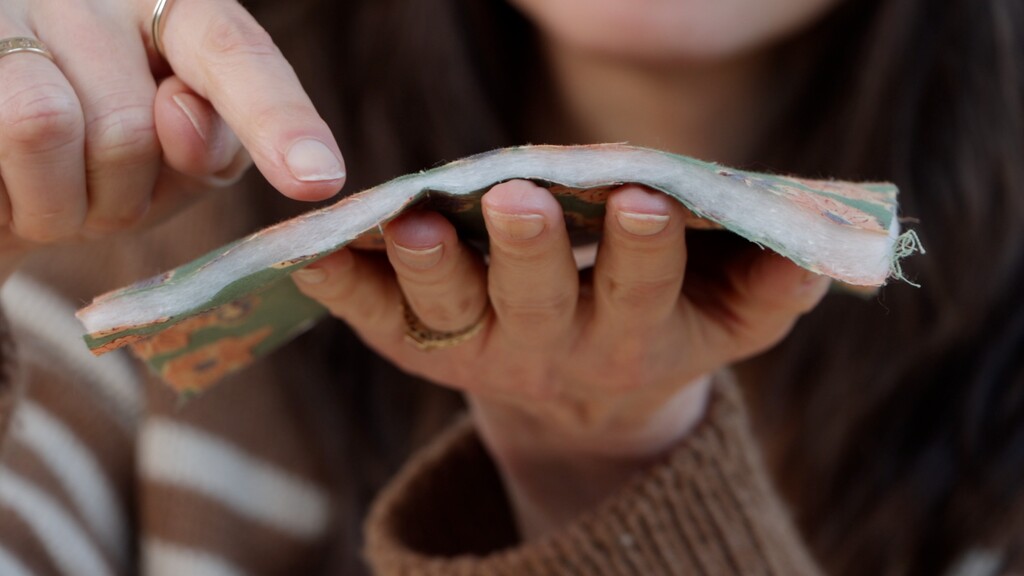 Close-up cross-section showing the three layers of pre-quilted fabric