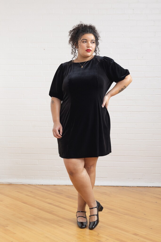 model wearing a black Pomme dress