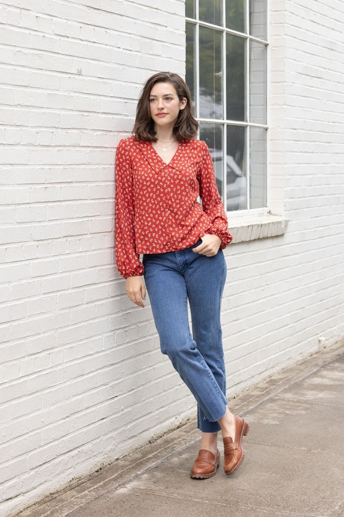 Woman modeling red Cosmo blouse